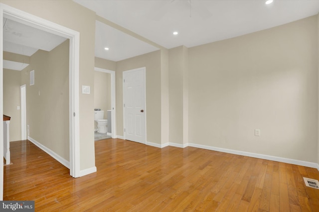 empty room with light hardwood / wood-style floors