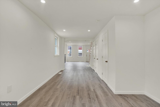 hallway with light wood-type flooring