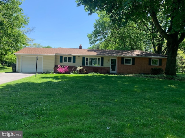 single story home with a garage and a front yard