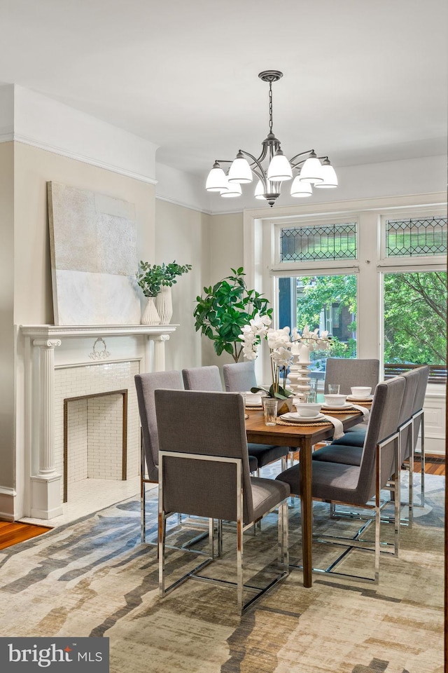 dining space featuring hardwood / wood-style floors and an inviting chandelier