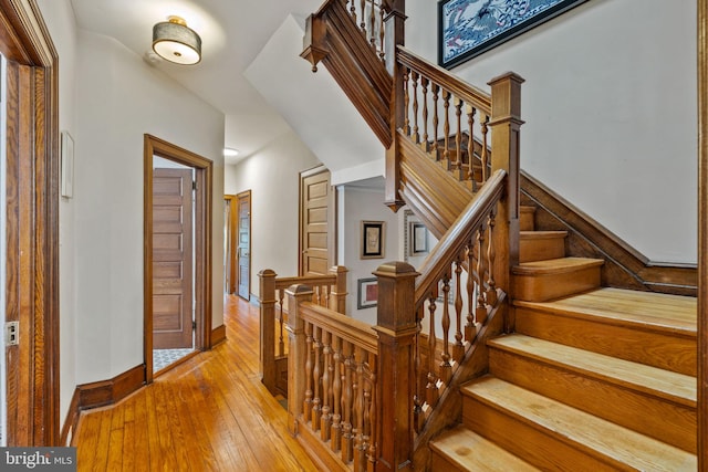 stairs with wood-type flooring