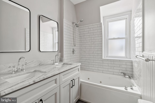 bathroom featuring vanity and tiled shower / bath combo