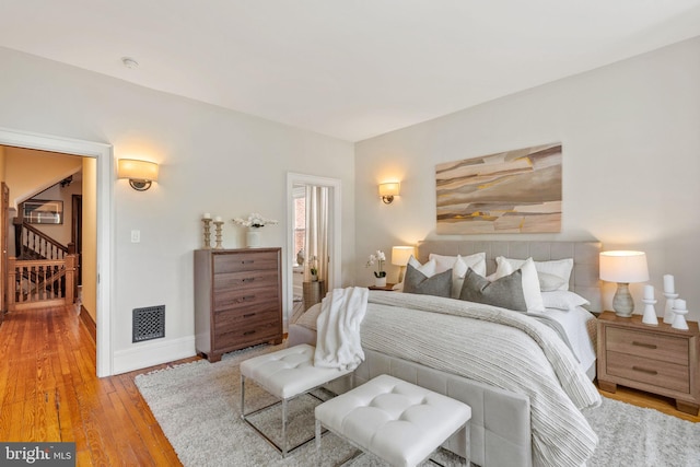 bedroom with light wood-type flooring