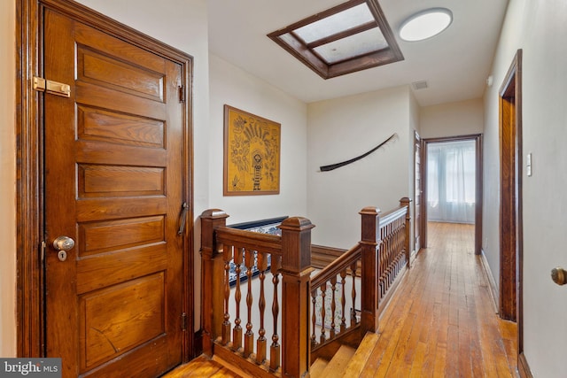 hallway with light wood-type flooring