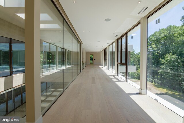 hallway featuring floor to ceiling windows