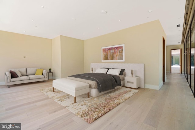 bedroom with light hardwood / wood-style floors