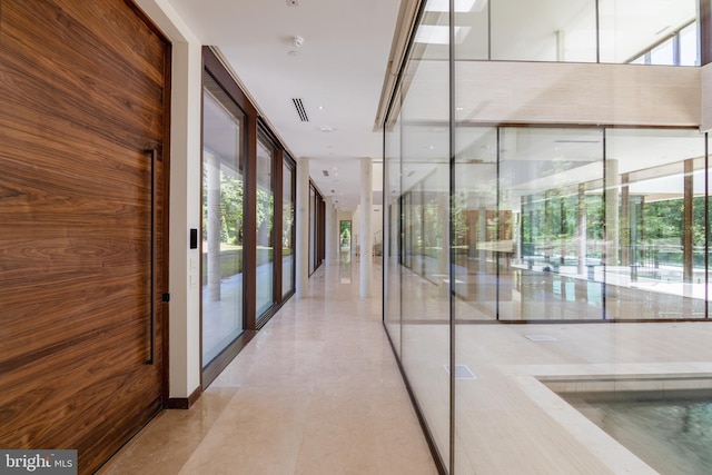 hallway with expansive windows