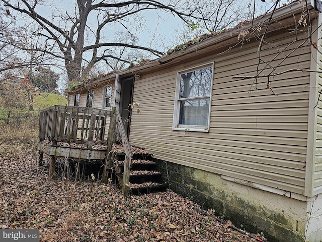 view of home's exterior featuring a deck