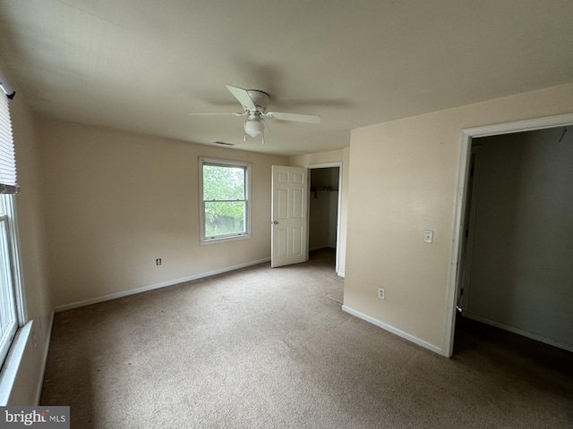 unfurnished bedroom featuring ceiling fan and carpet flooring