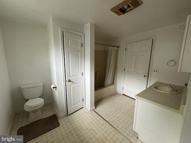 bathroom with vanity, toilet, and tile flooring