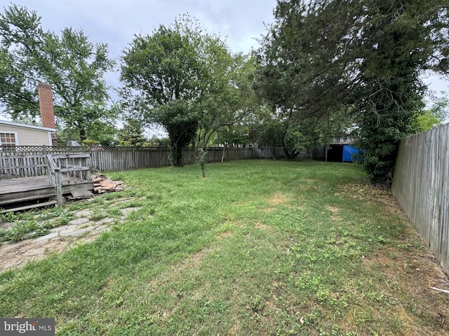 view of yard with a wooden deck