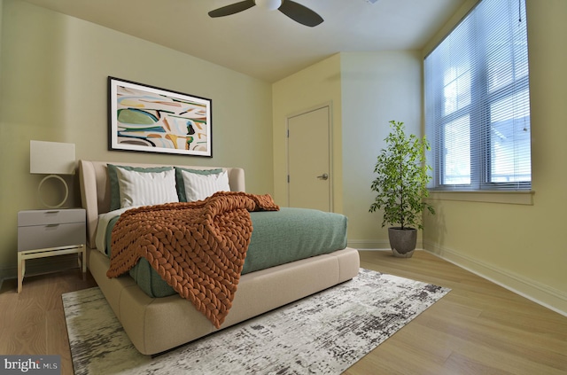 bedroom featuring ceiling fan and hardwood / wood-style floors