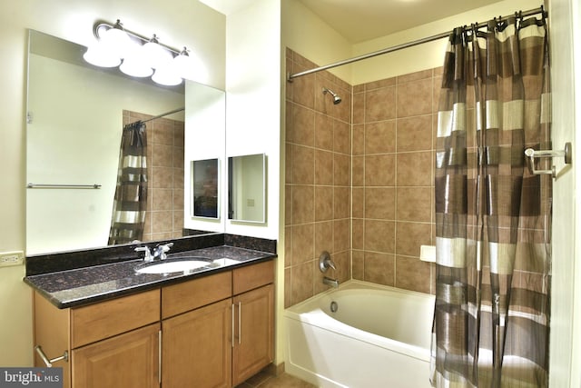 bathroom with shower / tub combo with curtain and vanity