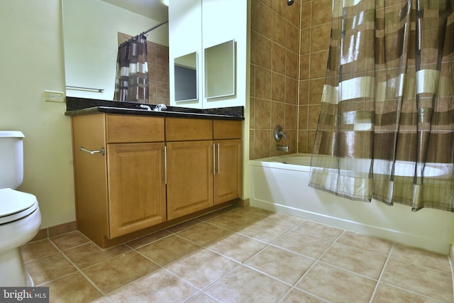 full bathroom featuring tile flooring, toilet, vanity, and shower / bath combo