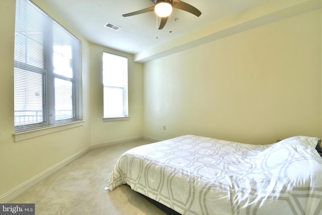 bedroom with ceiling fan and carpet flooring