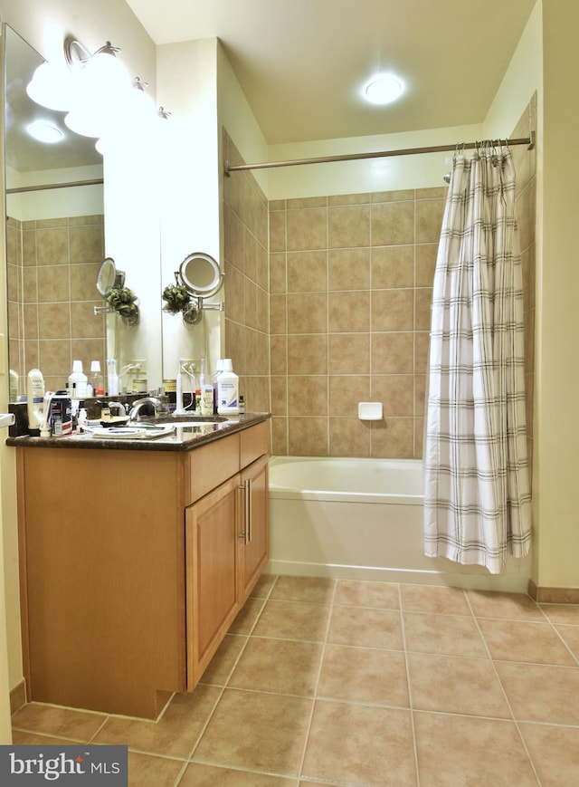 bathroom with tile floors, vanity, and shower / bath combo with shower curtain