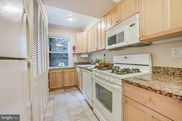 kitchen featuring light stone counters, light tile patterned flooring, ornamental molding, white appliances, and light brown cabinetry