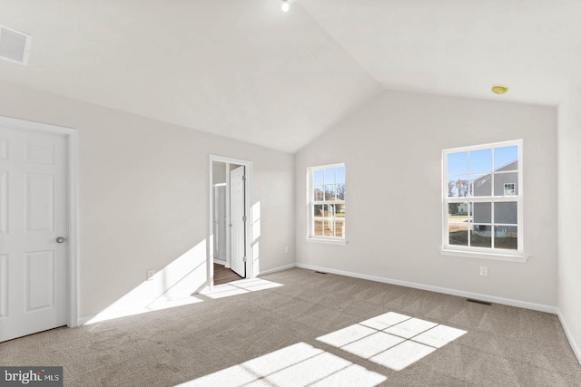 unfurnished bedroom with lofted ceiling and light carpet