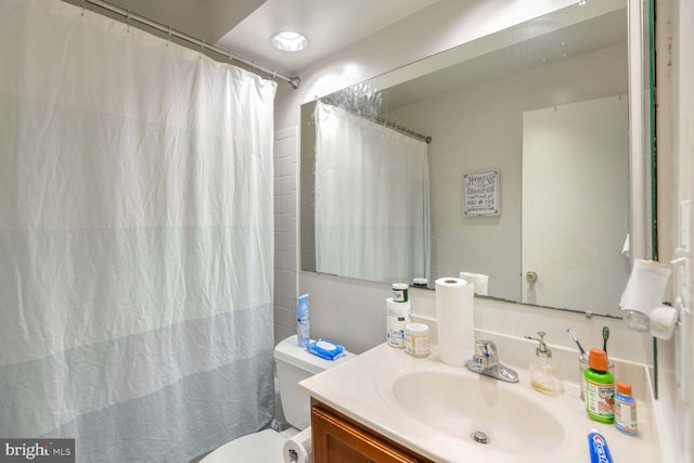 bathroom with vanity and toilet