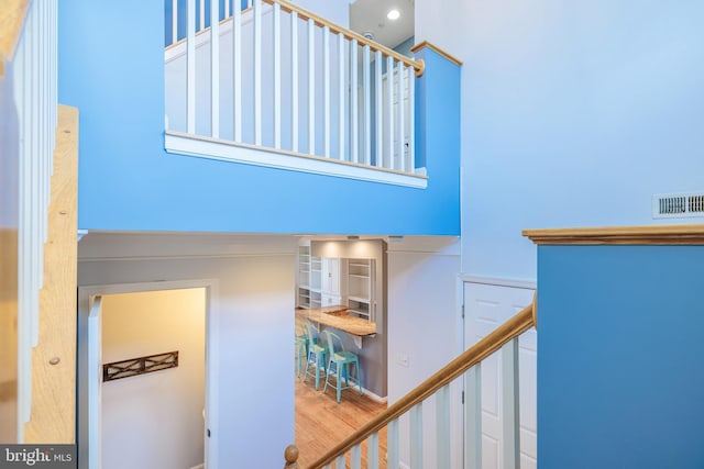 stairs with wood-type flooring