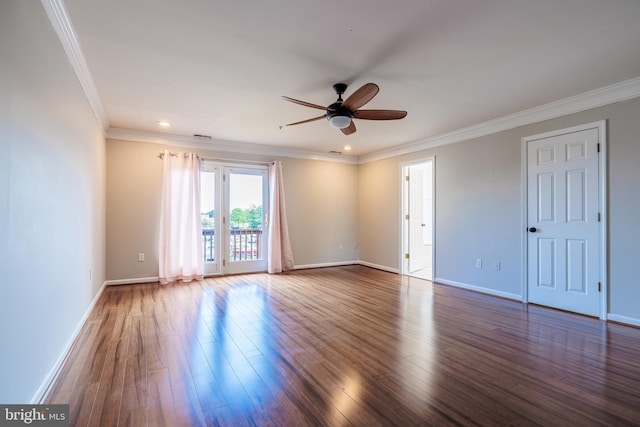 spare room with ceiling fan, dark hardwood / wood-style flooring, and ornamental molding