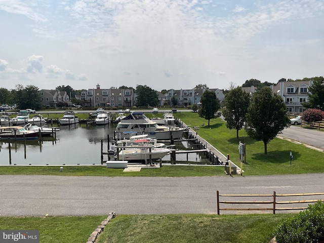 dock area featuring a yard and a water view