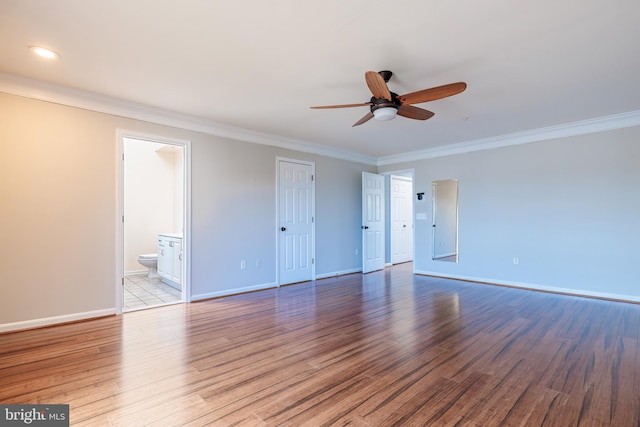 empty room featuring crown molding, ceiling fan, and light wood-type flooring