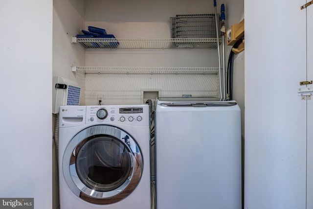 laundry area featuring independent washer and dryer