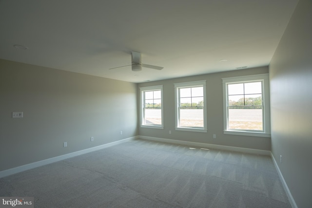 22430 Hummingbird Rd, Ellendale, DE 19941 - carpeted spare room with baseboards, visible vents, a ceiling fan, and a wealth of natural light