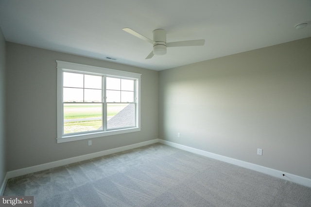 22430 Hummingbird Rd, Ellendale, DE 19941 - carpeted spare room with visible vents, a ceiling fan, and baseboards