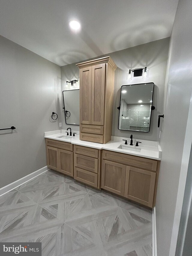 22430 Hummingbird Rd, Ellendale, DE 19941 - full bath featuring a sink, baseboards, and double vanity