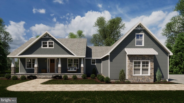 craftsman inspired home featuring a front yard and a porch