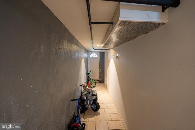 hallway featuring light tile patterned floors