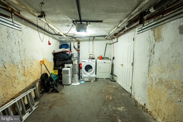 unfinished below grade area with washing machine and dryer