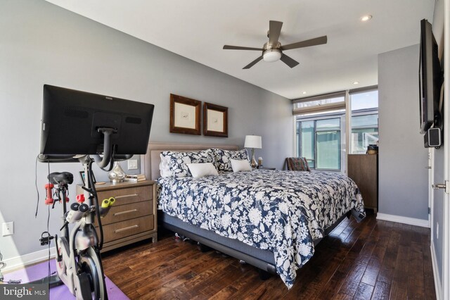 bedroom featuring ceiling fan and dark wood-type flooring