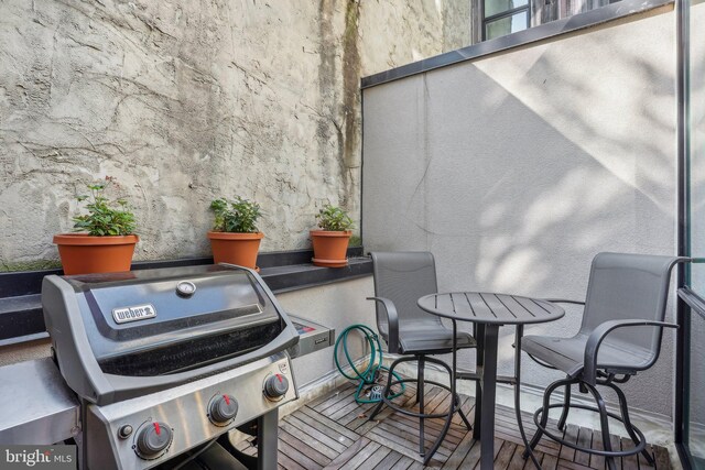 wooden terrace with grilling area