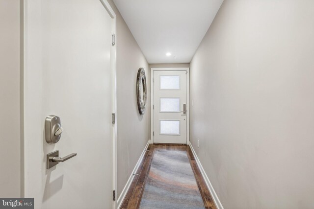 doorway to outside featuring dark hardwood / wood-style floors