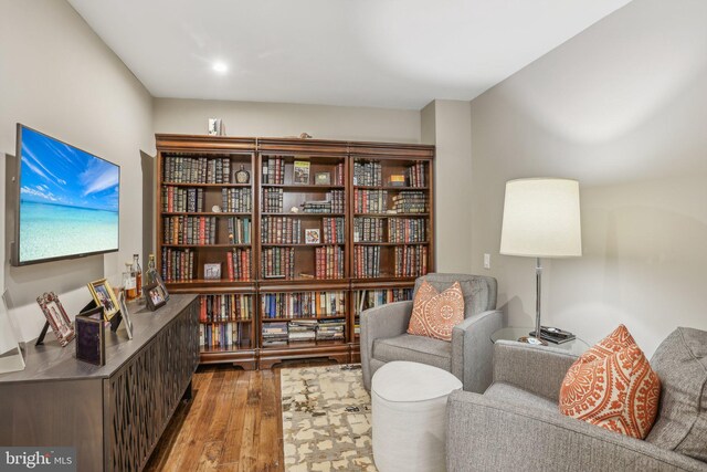 sitting room with hardwood / wood-style floors