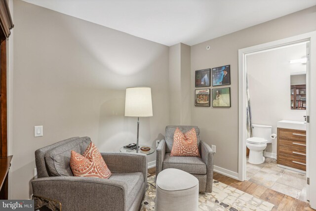 sitting room featuring light hardwood / wood-style floors