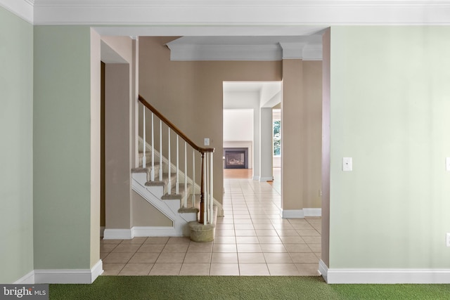 interior space featuring crown molding and light colored carpet