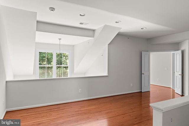 unfurnished living room featuring wood-type flooring