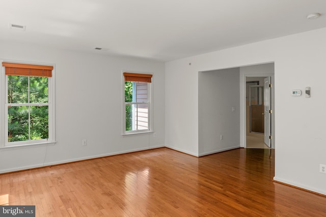 unfurnished room featuring light hardwood / wood-style flooring