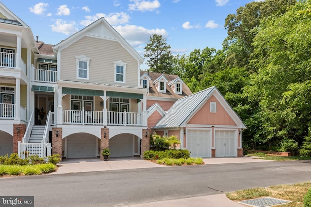 view of property featuring a porch and a garage