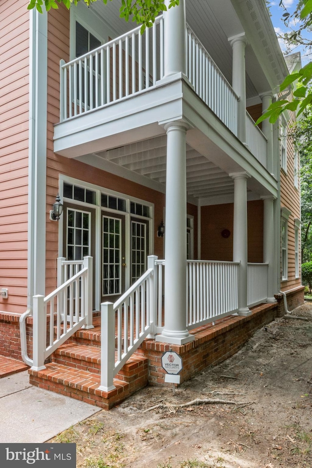 property entrance with covered porch