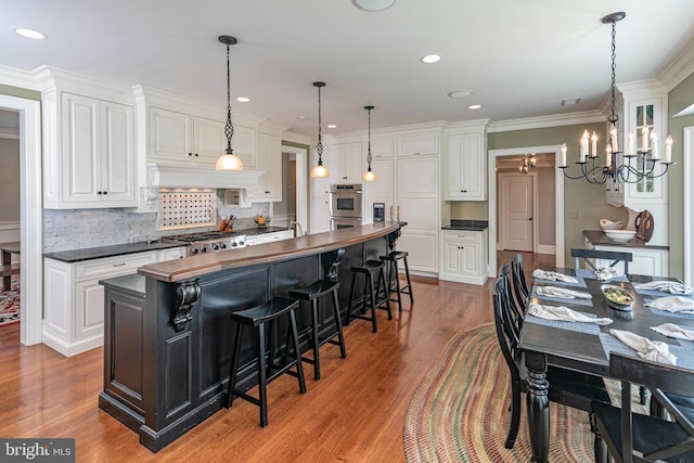 kitchen with backsplash and white cabinetry