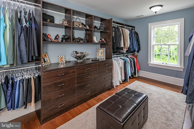 walk in closet featuring hardwood / wood-style floors