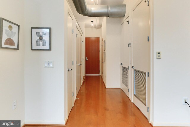 hallway featuring hardwood / wood-style flooring