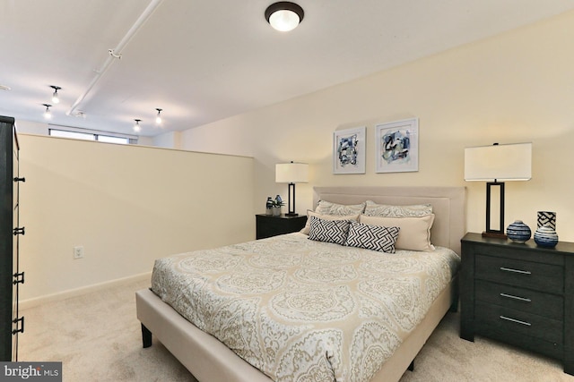 bedroom featuring light colored carpet