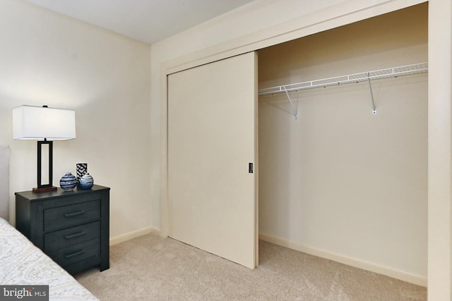 carpeted bedroom featuring a closet