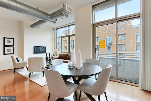 dining room with light hardwood / wood-style flooring